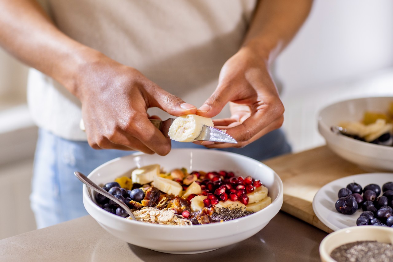 Woman preparing a bowl of oatmeal