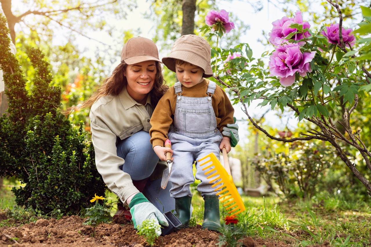 Mother and son gardening together
